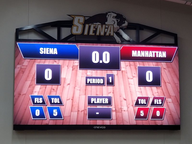 Technicians wiring videoboard cabinet